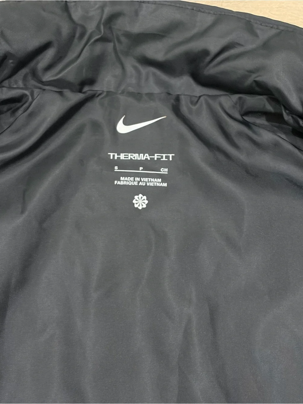 Nike women’s Black Quilted Vest with White Swoosh